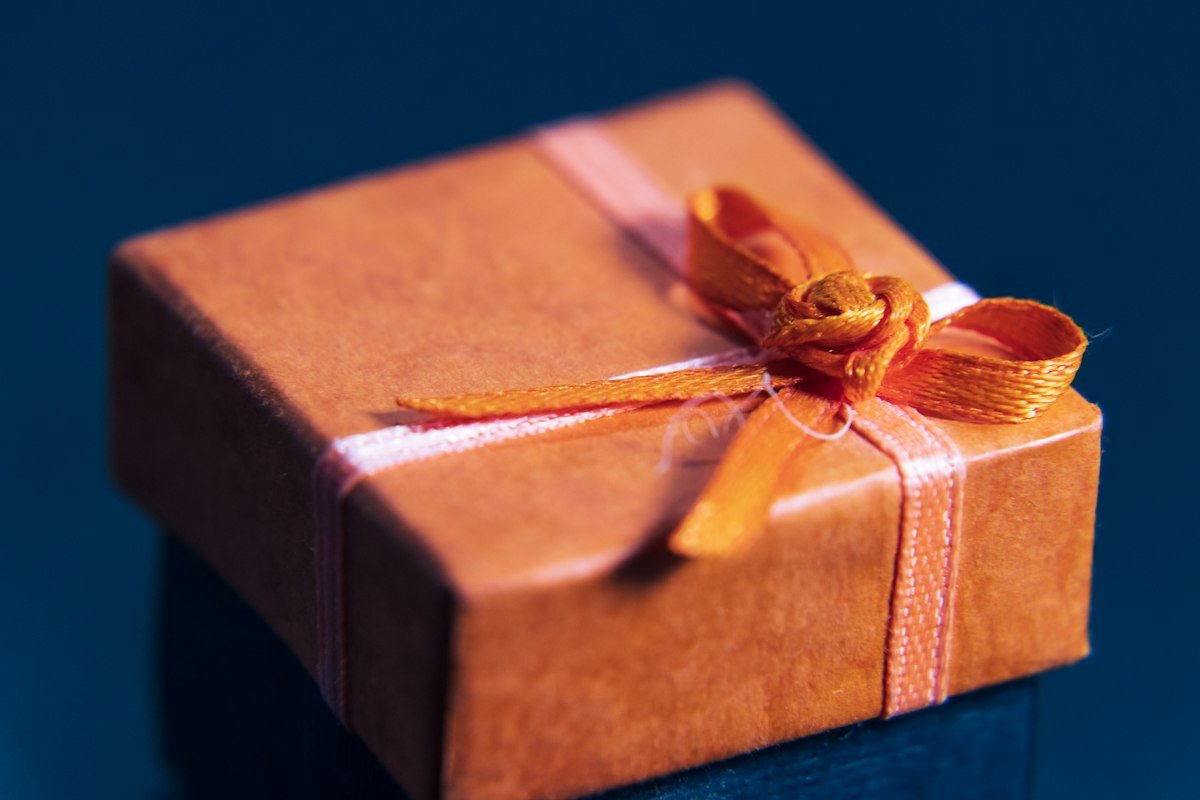 Corporate gift box wrapped with ribbon for client gifting